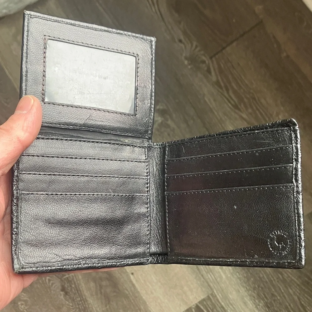 black bifold wallet made from genuine ostrich leather.